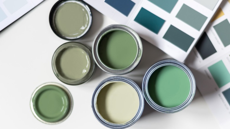 Cans of green paint