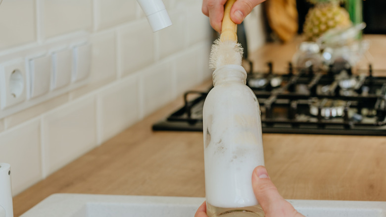 Cleaning bottle with brush