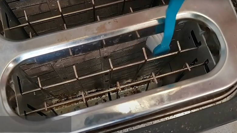 Cleaning toaster with a toothrbrush