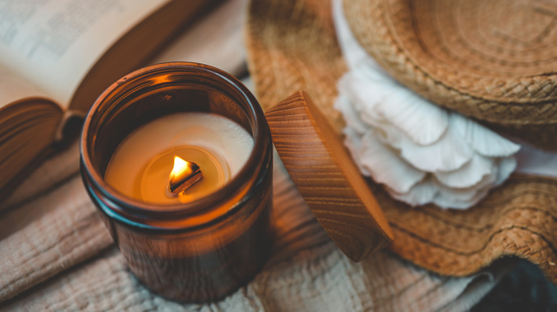 Lit candle on a table