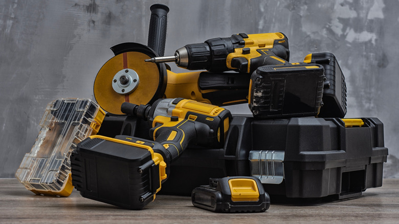 A pile of battery-operated DeWalt power tools