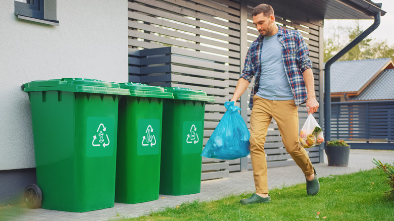 man taking out the trash