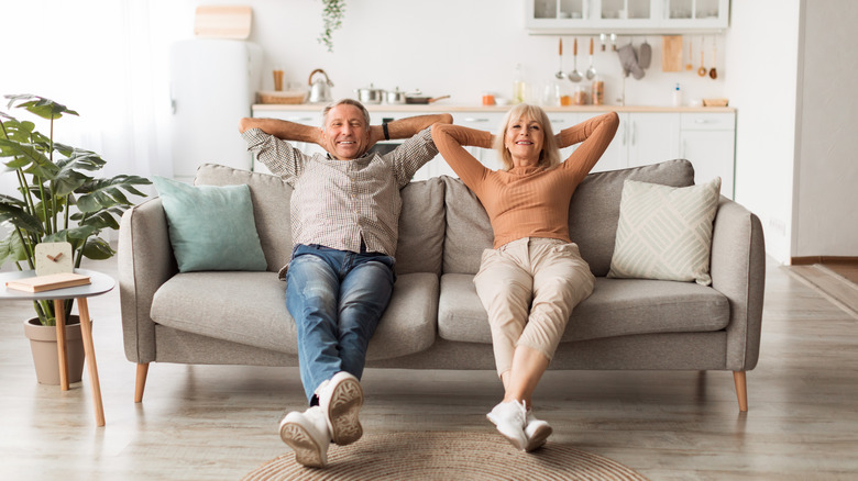 older couple relaxing on couch