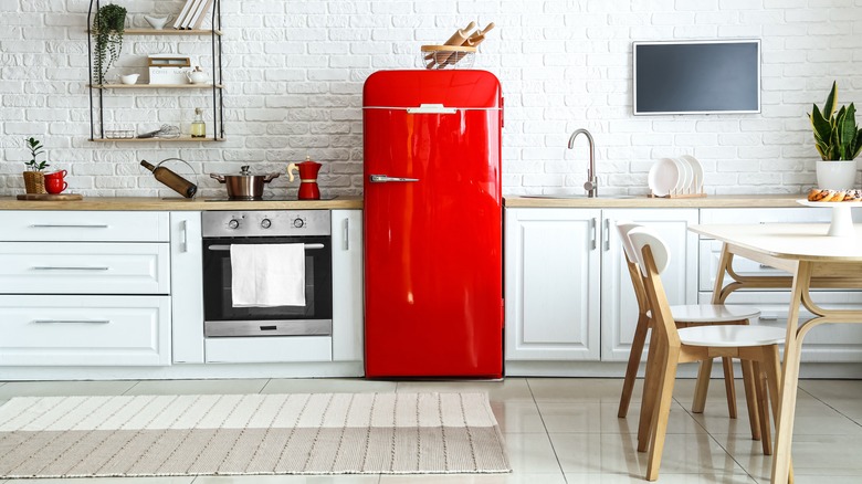 Red fridge in modern kitchen