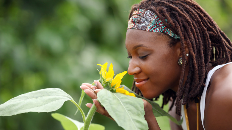 Woman smelling flowers