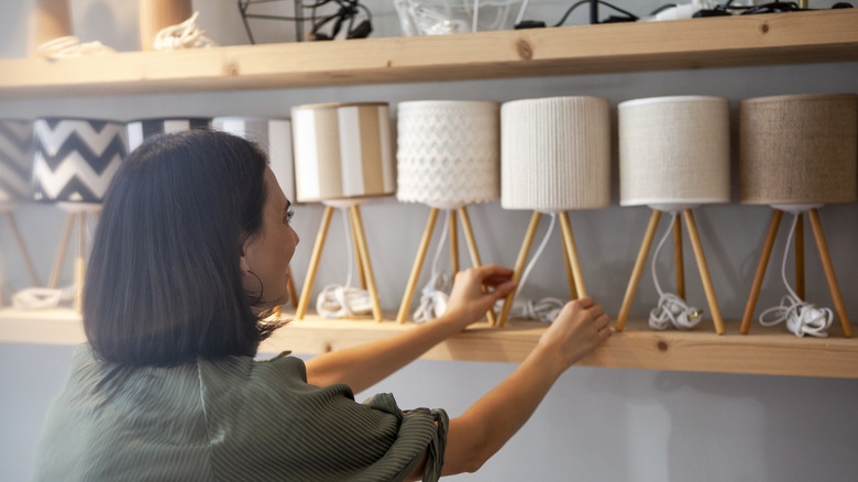 woman shopping for lamps