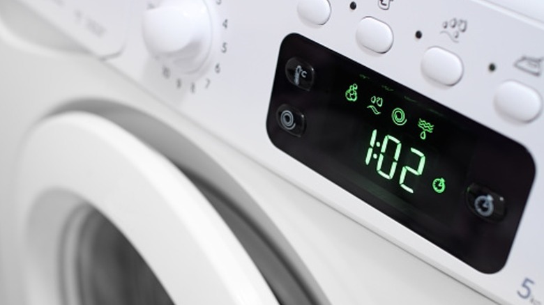 closeup of washing machine display showing 1:02