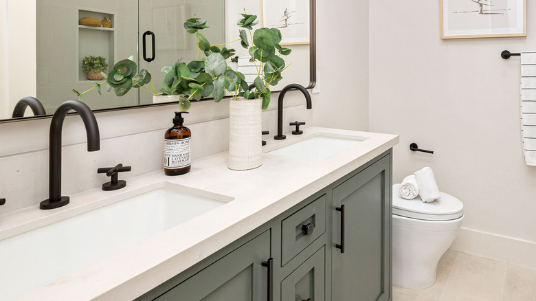 Bathroom undermount sinks with black faucets
