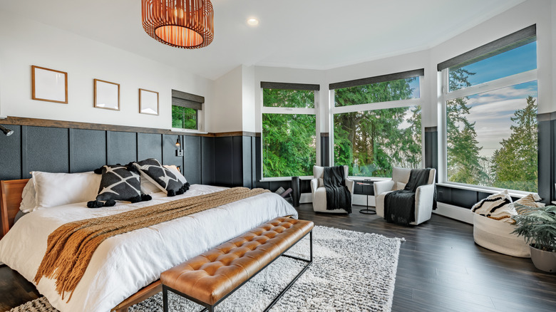 A bedroom filled with several throw blankets.