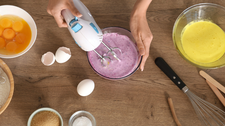 using hand mixer in kitchen