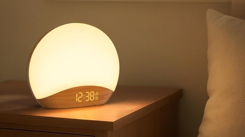 A bright sunrise machine in a bedroom on a nightstand