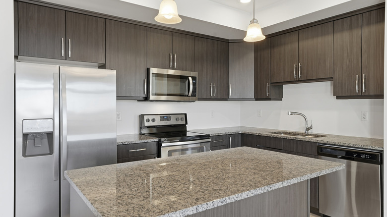 Kitchen with cabinets and granite countertops