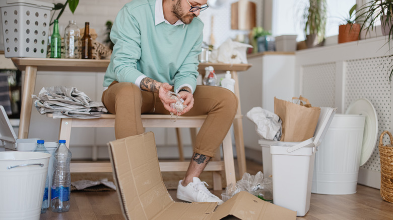 Person breaking down cardboard