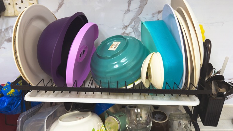 Cluttered dish rack on a counter