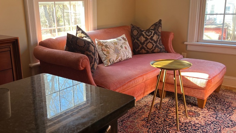 Pink couch in kitchen