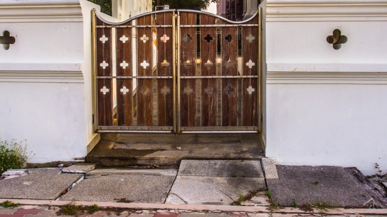 Concrete cracking outside backyard gate