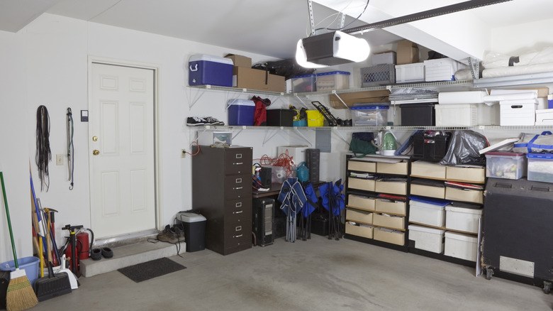 Home garage with organized corner filled with clean storage shelves and wire shelving on the walls