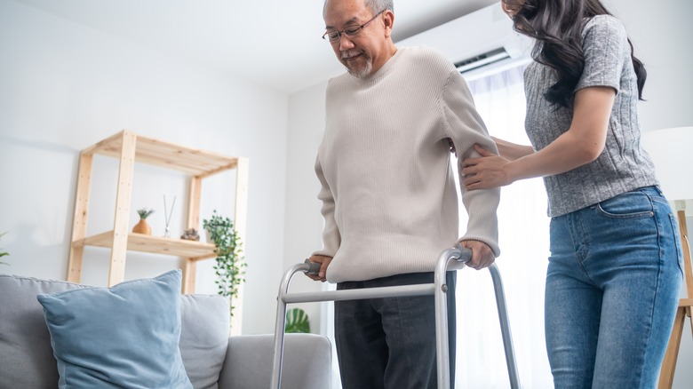 Person using crutch to walk
