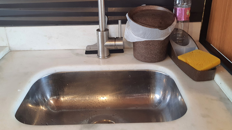 A closeup of a small, single-basin sink