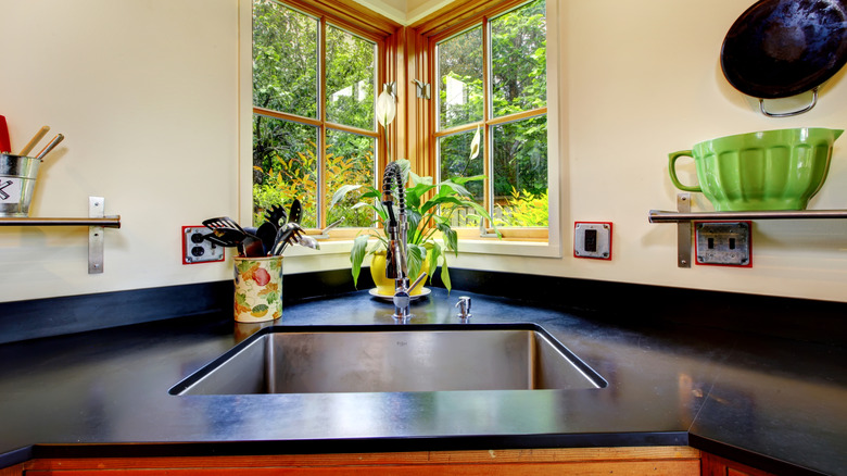 A deep basin sink in a corner of the kitchen