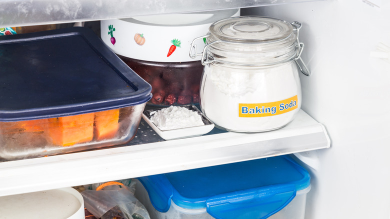 Jar of baking soda on fridge shelf