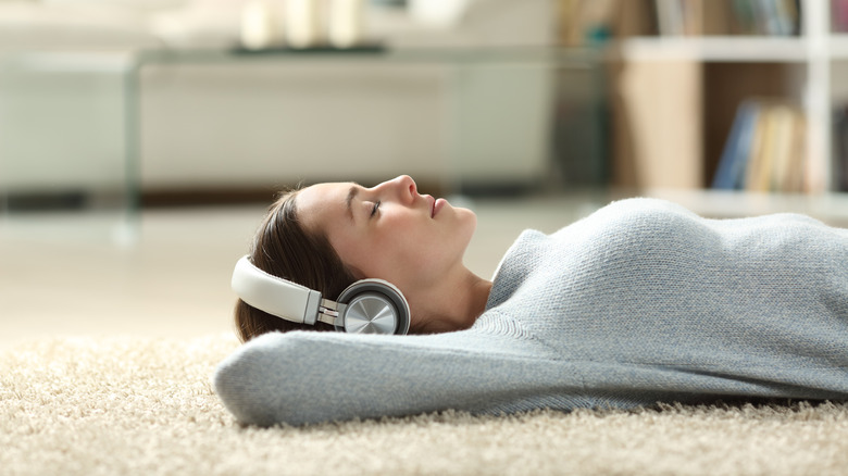 woman laying on carpet 