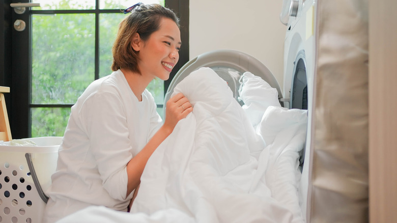 woman with blanket from laundry
