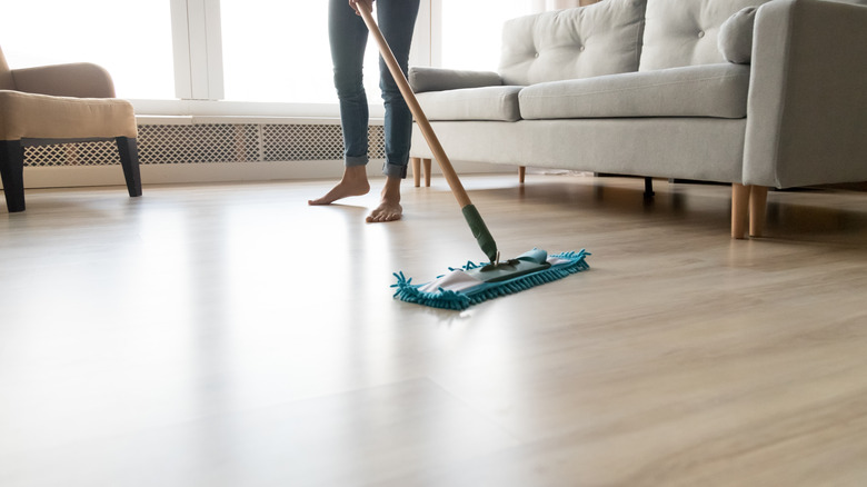 woman mopping floor