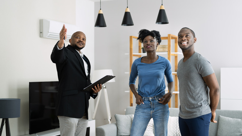 couple with real estate agent