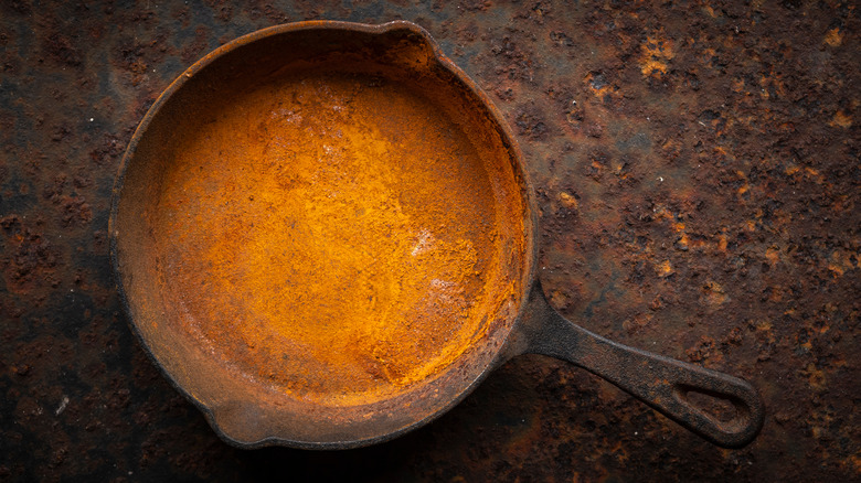 Extremely rusty cast iron skillet