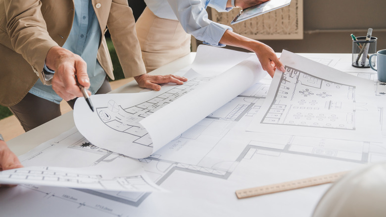 Architects reviewing plans for a home