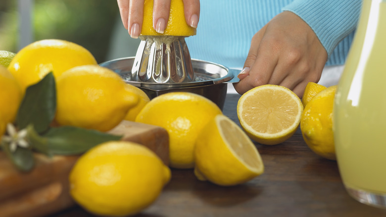 fresh lemons being juiced