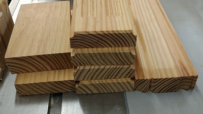 The grain of three short stacks of quarter sawn lumber are shown in a detail shot