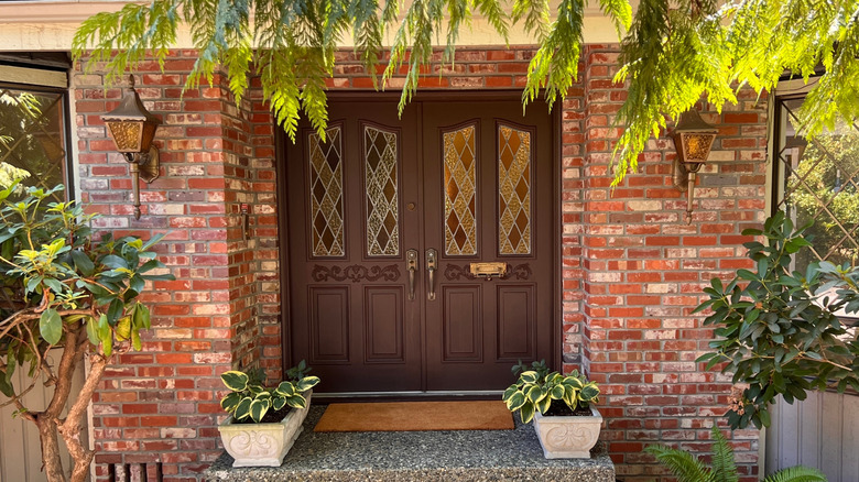 The front of a house with a Tudor-style door