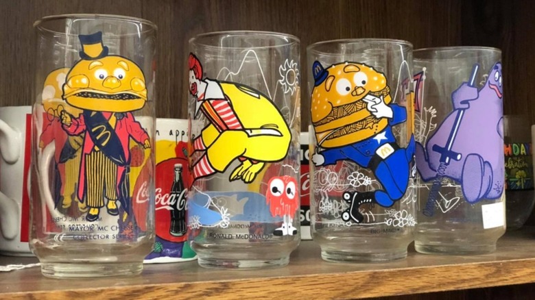 Vintage McDonald's glasses sitting on a shelf