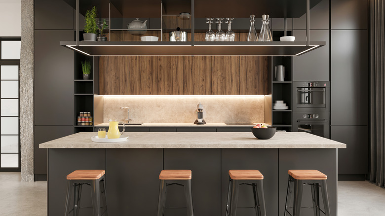 kitchen island with stools next to it