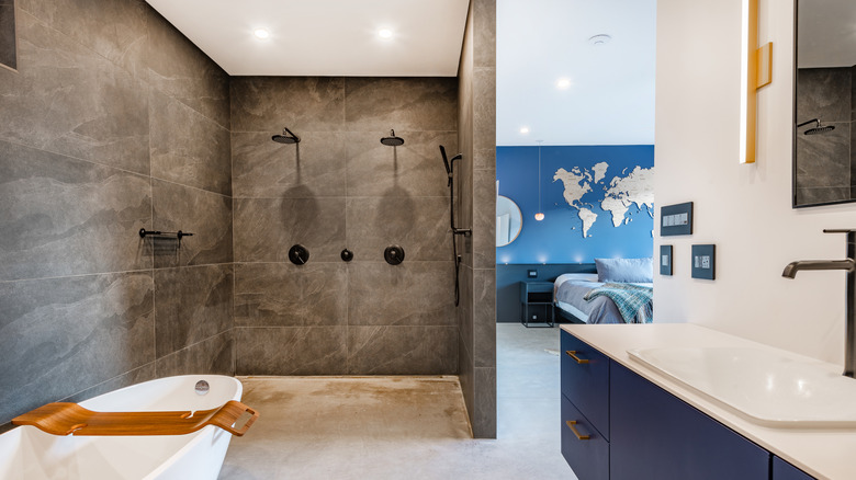 Modern bathroom with an open shower with gray tile