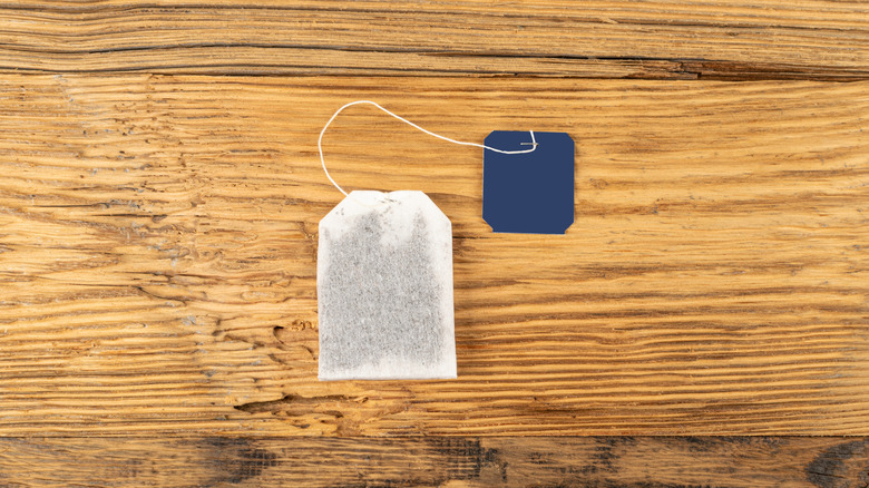 A tea bag on a wooden table