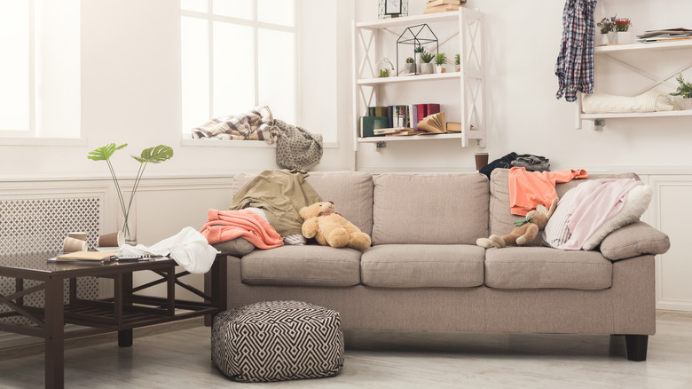 Living room with messy sofa