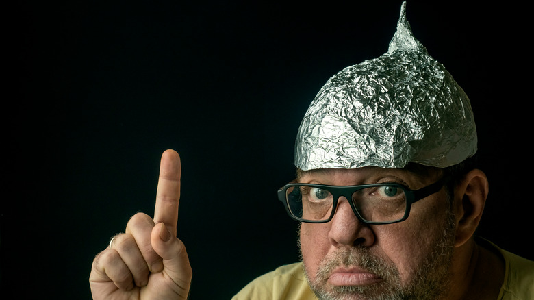 Man wearing aluminum foil hat