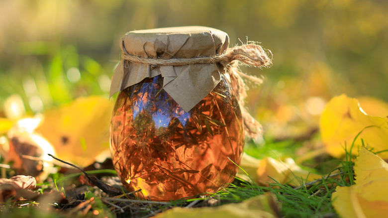 Jar of honey in garden