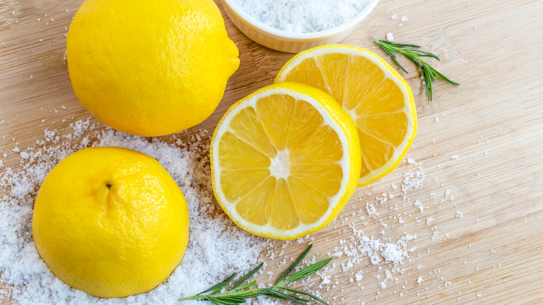lemons and salt on cutting board