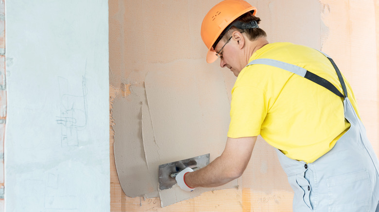Skim coating drywall surface