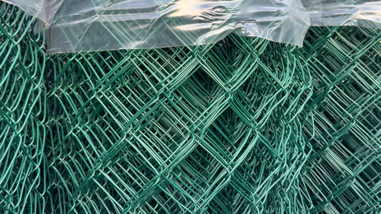 Rolls of green garden fencing