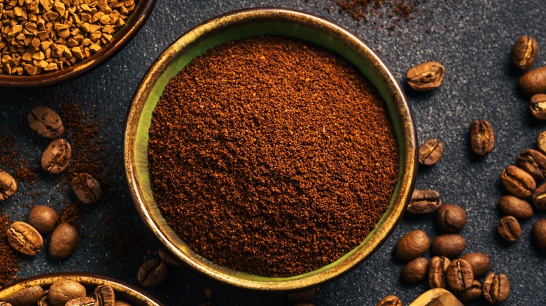 bowl of coffee grounds and beans