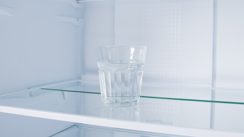 Glass of water inside fridge