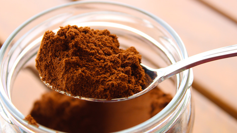 Jar of dry coffee grounds