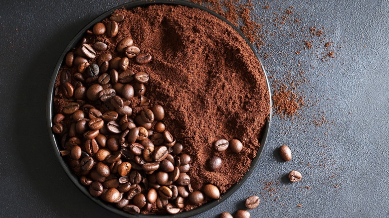 Coffee grounds and beans in bowl