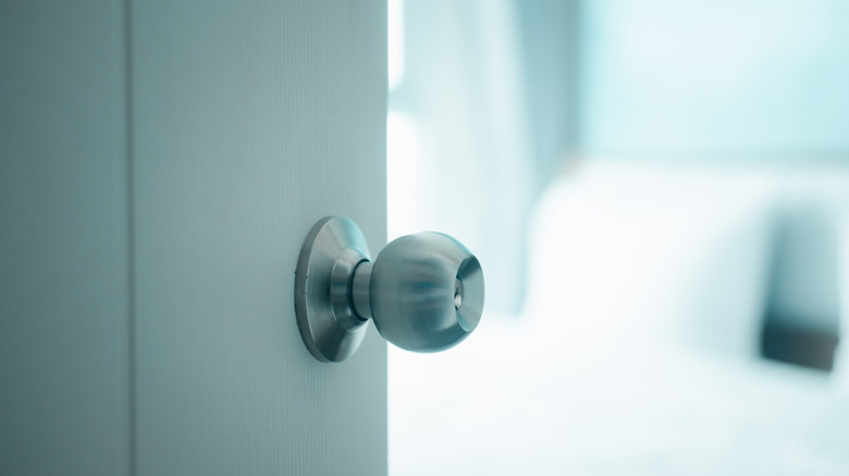 Half-opened door with blurred background