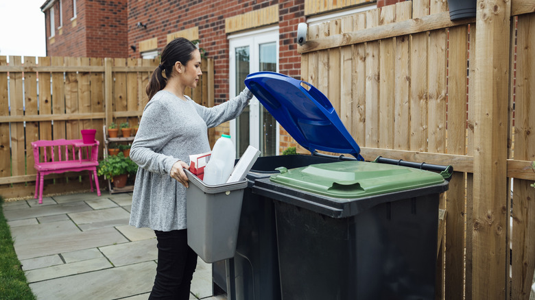 Woman taking out the trash